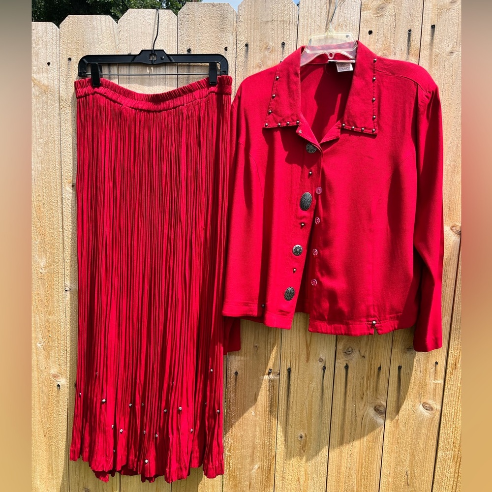 Stylish Stone Bridge red pleated skirt and matching jacket with stud details.